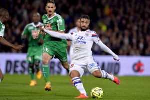 Lyon's French midfielder Nabil Fekir (R) shoots the ball  during the French L1 football match between Lyon and Saint-Etienne on April 19, 2015 at the Gerland stadium in Lyon. AFP PHOTO / PHILIPPE MERLE        (Photo credit should read PHILIPPE MERLE/AFP/Getty Images)