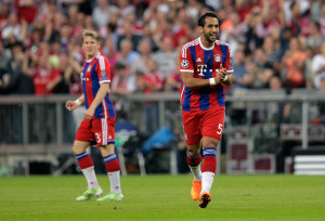 MUNICH, GERMANY - MAY 12:  Mehdi Benatia of Bayern Muenchen (R) celebrates scoring the opening goal during the UEFA Champions League semi final second leg match between FC Bayern Muenchen and FC Barcelona at Allianz Arena on May 12, 2015 in Munich, Germany.  (Photo by Adam Pretty/Bongarts/Getty Images)