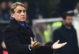 Inter Milan's coach Roberto Mancini gestures during the Serie A football match between AC Milan and Inter at San Siro Stadium in Milan on November 23, 2014.  AFP PHOTO / GIUSEPPE CACACE        (Photo credit should read GIUSEPPE CACACE/AFP/Getty Images)