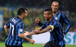 Inter's Gary Medel (L) jubilates with his teammates Fredy Guarin and Joao Miranda (R) after scoring the goal during the Italian Serie A soccer match FC Inter vs AS Roma at Giuseppe Meazza stadium in Milan, Italy, 31 October 2015. ANSA/MATTEO BAZZI
