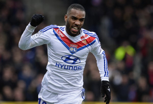 Lyon's French forward Alexandre Lacazette celebrates after scoring a goal during the French L1 football match Olympique Lyonnais (OL) vs Evian Thonon Gaillard (ETG) on January 26, 2014, at the Gerland Stadium in Lyon, central-eastern France. AFP PHOTO / JEFF PACHOUD (Photo credit should read JEFF PACHOUD/AFP/Getty Images)