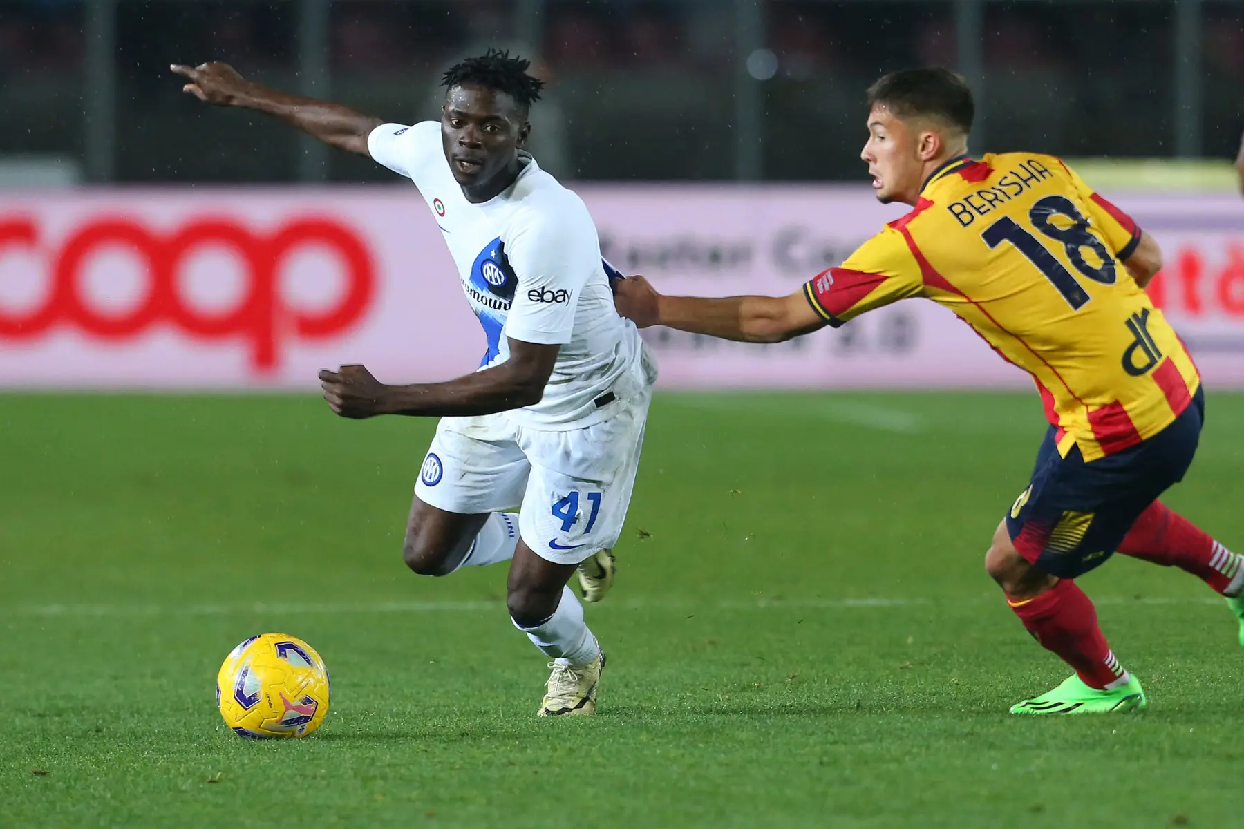 Ebenezer Akinsanmiro in an Inter Milan kit dribbling a soccer ball during a match