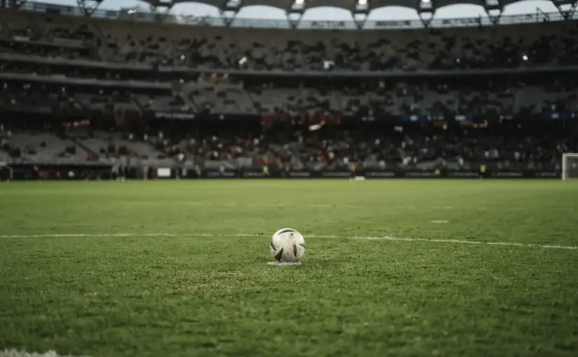 Football near the penalty spot under stadium lights after Inter and Milan's Perth derby draw