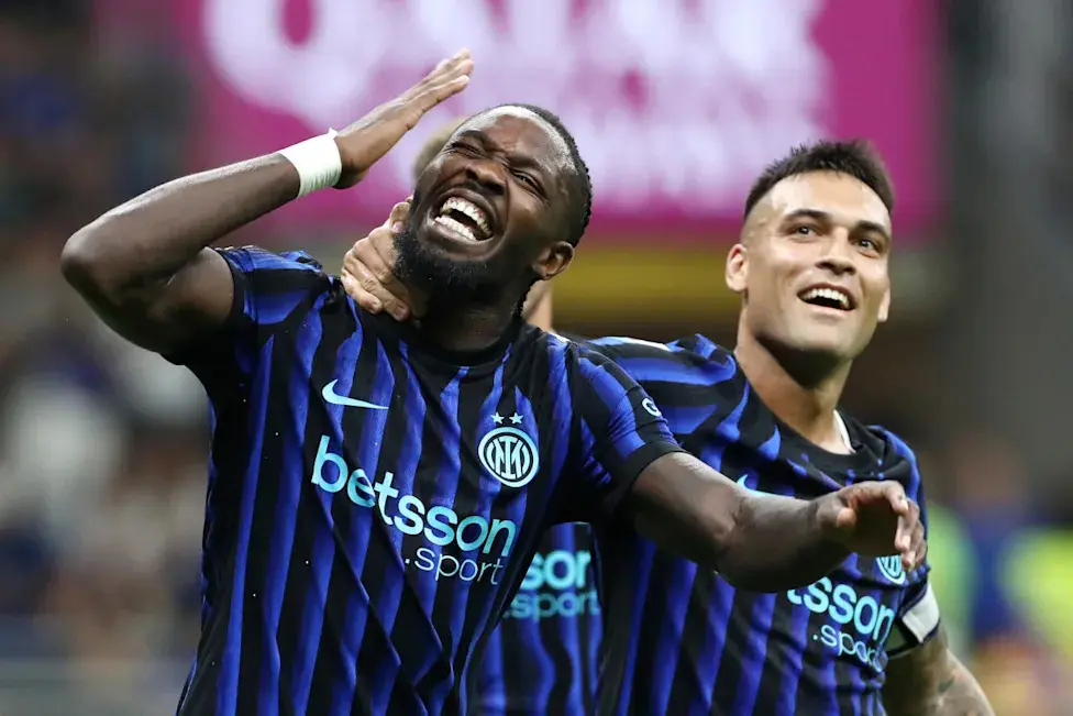 Marcus Thuram celebrating with Lautaro Martinez in Inter Milan home kits