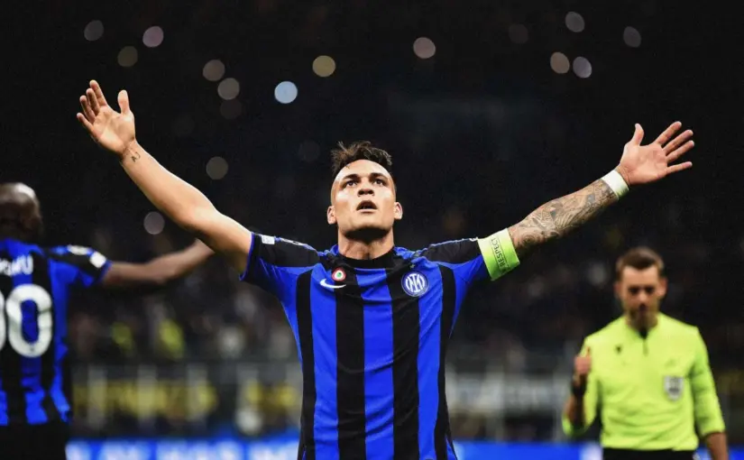 Lautaro Martínez of Inter Milan celebrating with arms wide open during a match.