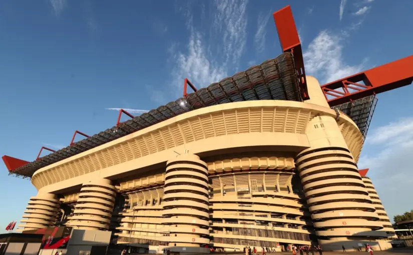 Exterior view of the San Siro stadium under a clear blue sky