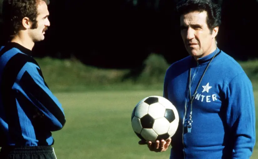 Sandro Mazzola and Helenio Herrera on a football pitch
